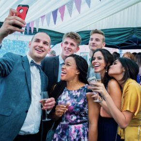 Buckinghamshire Marquee Wedding Photography - selfie time for a portrait with this group of friends