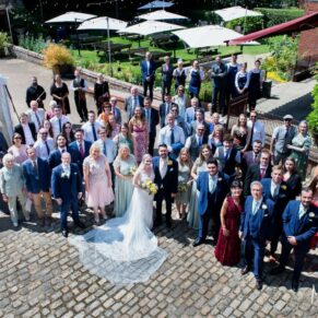 Buckinghamshire Marquee Wedding Photography - the group shot of everyone captured from high above at the Five Arrows Hotel