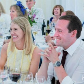 Smiling guest reactions really capture the moment during the lively marquee speeches