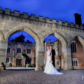 Striking floodlit pose of the bride and groom captured at the front of this historic Grade I listed property