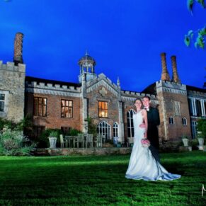 Dramatic night pose at the back of the property with the newlyweds and the building being illuminated by my floodlighting