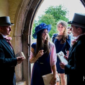 Guests entering the parish church in readiness to witness this summer marriage ceremony