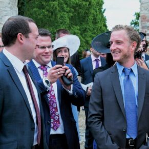 Reportage imagery on the venue's lawns of a group of friends enjoying the party vibes