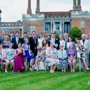 Large formal group pose in front of the Grade I listed property