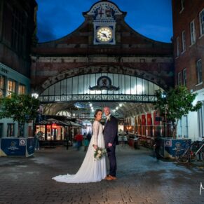 Buckinghamshire Winter Wedding Photography - the newlyweds captured outside the old railway station in central Windsor
