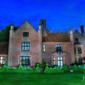 Atmospheric exteriors under floodlighting at for this summer wedding