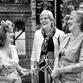 Three ladies giggling away for this informal image at this summer wedding