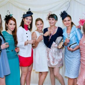 A group of ladies pose for my camera in the marquee during the evening reception at Chenies Manor