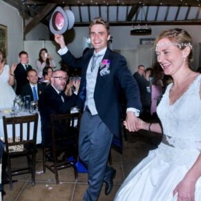 The newlyweds are announced into the meal to lots of cheers on their special day at Chenies Manor