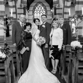 Small family group pose inside the parish church at Clearwell Parish Church