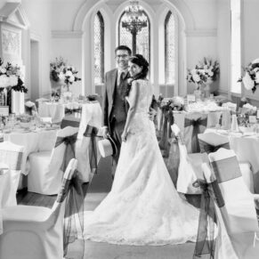 The newlyweds pose for my camera in the dramatic dining room at Clearwell Castle prior to their wedding breakfast