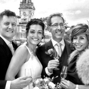 The couple with their parents captured on the private terrace at their Cliveden House Hotel wedding