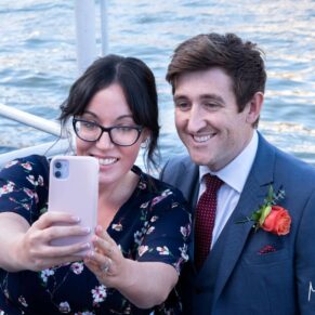 A smiling selfie capture for this couple with a river backdrop at this Compleat Angler wedding drinks reception