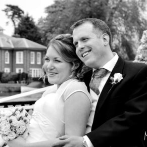 The newlyweds looking really relaxed for this natural shot in the gardens as they look over the river from their wedding reception at The Compleat Angler