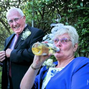 Who says you need a glass to consume wine during the wedding drinks reception at Danesfield House
