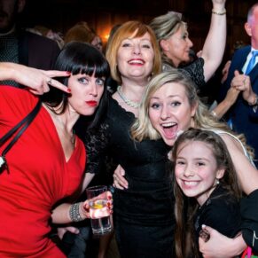 These ladies strike a fun pose on the dance floor at this lively Dorton House evening wedding reception