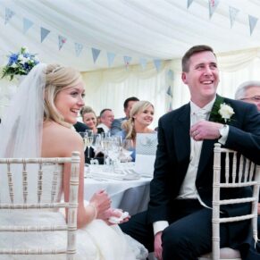 The newlyweds reactions captured during the lively marquee speeches at Buckinghamshire wedding reception
