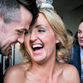 Gatsby Berkhamsted - Hertfordshire Wedding Photographer - reportage shot of a giggling couple during the drinks reception