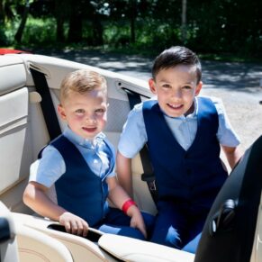 These young lads loved posing inside the groom's Ferrari for this relaxed photo