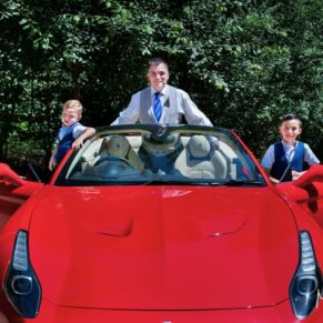 The groom arrives with his sons in a red Ferrari for his Buckinghamshire woodland marriage ceremony
