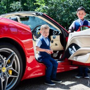 These young lads were wishing they could drive the Ferrari they arrived in for this woodland marriage ceremony