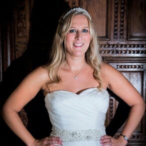 Dramatically lit bridal portrait captured on the balcony in the Great Hall