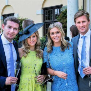 A group of four young friends pose for my camera during the drinks reception