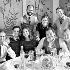 Friends group pose captured at their table during the meal at this relaxed gathering