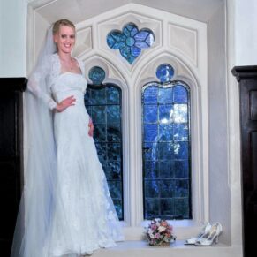 Bridal portrait in a fabulous full length feature window at the historic venue