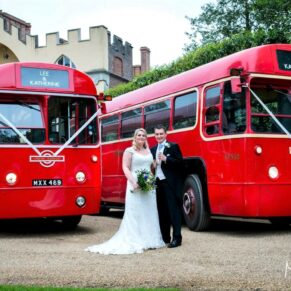 The newlyweds pose beside their London buses at this grand Buckinghamshire Estate