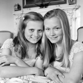 The young bridesmaids captured in a casual indoor pose