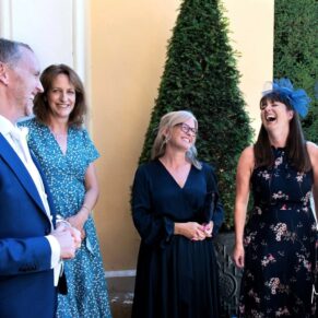 The groom enjoys some banter with his guests before the civil ceremony