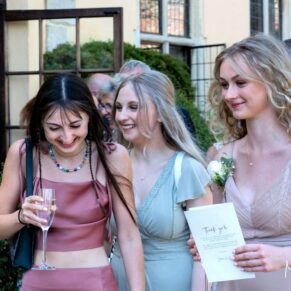 Laughter between these three ladies during the lively drinks reception