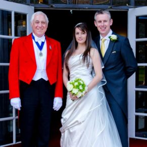 Harte and Garter Hotel Windsor Wedding Photography - the newlyweds outside the venue's main entrance