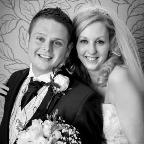 Harte and Garter Hotel Windsor Wedding Photography - the bride and groom pose for this black and white image capture