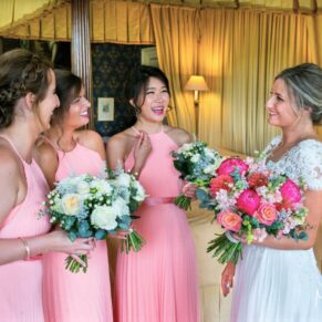 The bride with her bridesmaids captured informally in the bridal suite before the ceremony at this Hartwell House wedding
