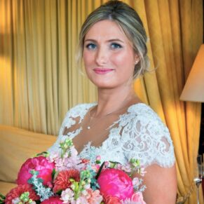Portrait of the bride captured with stunning window light in the bridal suite at Hartwell House wedding