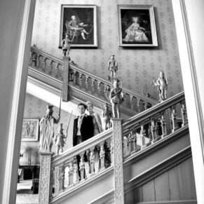 The Jacobean staircase provides a striking backdrop for this photo opportunity with the newlyweds at Hartwell House