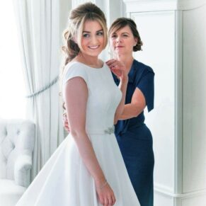 Mum helps her daughter with the final preparations before the civil ceremony at her Hedsor House wedding