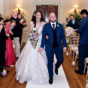 The happy newlyweds exit the civil ceremony at their Hedsor House wedding