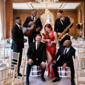 The Function Band larking around just prior to their live performance at this Hedsor House wedding reception! These guys are incredibly talented, and they perform their live set throughout the day to their appreciative audience. As they roam around during the celebrations, the natural photo opportunities are endless for me. Wedding bands don't get much better than these guys, do check out their website. The function band all set and ready to perform for the guests during the meal at this fabulous Hedsor House wedding reception