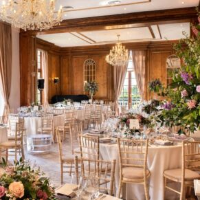 The grand dining room interior all setup at Hedsor House for the wedding breakfast