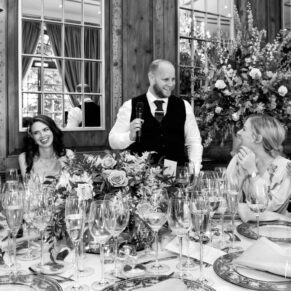 The groom's lively speech in progress in the mirrored dining room