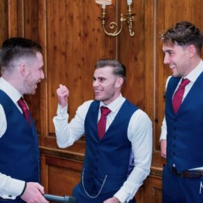 Lads enjoying the lively banter during the indoor drinks reception at Hedsor House