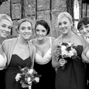 The bridesmaids pose for my camera with the historic buildings providing a perfect backdrop at the Kings Chapel in Old Amersham
