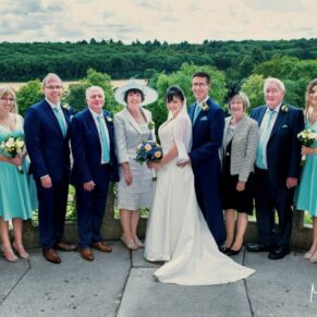 Fabulous distant views for this family group photography pose on the terrace at this Latimer Estate wedding