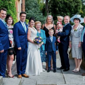 Wedding group pose on the upper terrace of the Latimer Estate