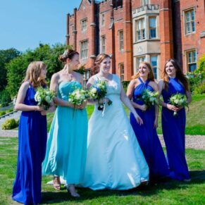 The ladies take a stroll in the beautiful gardens with the hotel seen behind
