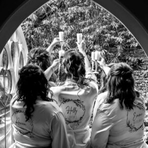 The ladies charge their champagne glasses before the ceremony at this stunning Old Windsor venue
