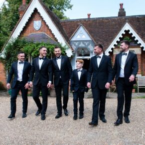 The lads take a stroll before the ceremony outside one of the cottages at this Little Dower House wedding in Old Windsor